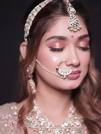 It's all in the details. We don't just rent outfits; we provide the complete look. This close-up shows our stunning bridal jewellery, including the maang tikka, nath, and necklace, all available to rent with your lehenga.