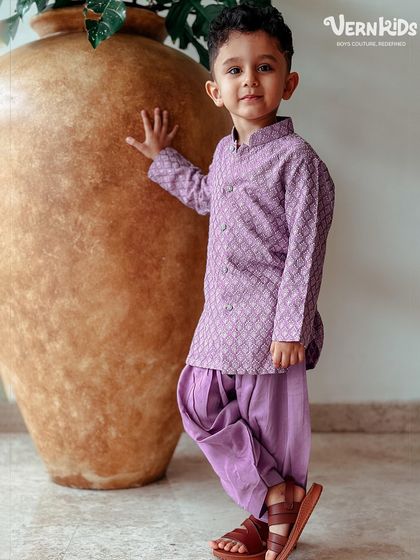 A full-length view of our client in the lavender Patiala set. The comfortable fit and stylish color make it a fantastic choice for any festive event.