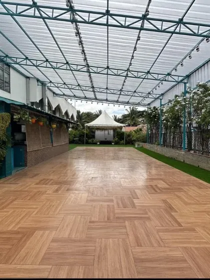 The spacious wooden floor of the Terrace Garden, a versatile base for any event layout, from dance floors to dining setups.