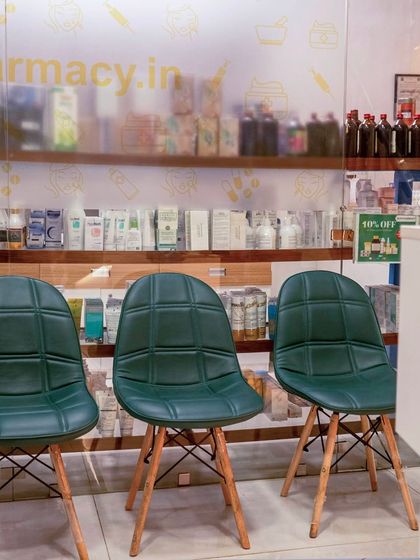 The waiting area at our clinic, with our pharmacy in the background. We ensure a comfortable and professional environment from the moment you walk in.