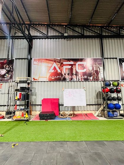 A look at our functional training area, complete with an artificial turf strip, climbing ropes, and wall balls. This space is perfect for warm-ups, mobility work, and high-intensity metcons.