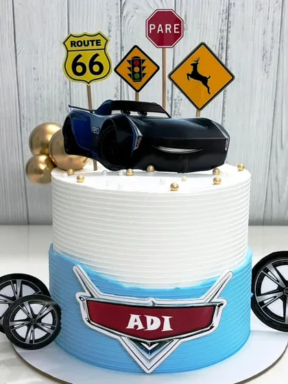 Full speed ahead for this Cars-themed cake. Featuring Jackson Storm and Route 66 signs, it's perfect for a little racer's big day.