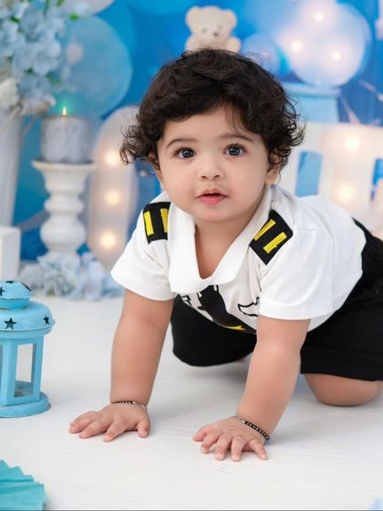 A pilot in training. This little boy is ready to fly in a cute pilot outfit, part of a fun transportation-themed shoot.
