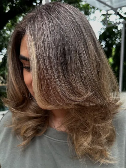 Another look at my 'Vanilla Butter Cream' creation. This is a fantastic way to blend grey hair into a stylish, modern blonde look. The ash tones help neutralize any brassiness for a cool, creamy finish.