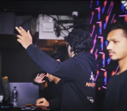 A candid moment of me directing the energy of the room. It's all about controlling the flow and keeping the party going.