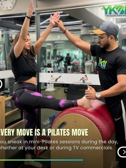 Another sign of a Pilates addict: you sneak in mini-Pilates moves throughout the day, whether at your desk or during TV commercials. Here, a client gets a great stretch on the spine corrector.