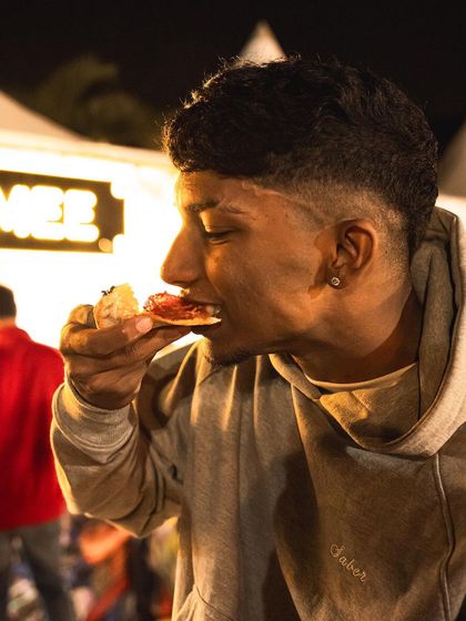 Enjoying a slice under the festival lights. We bring the full Brik Oven experience to events like the Gin Explorers Club.