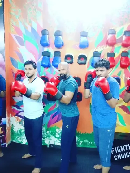 A group of our boxers posing after a tough training session, ready to apply what they've learned.