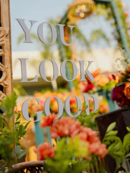 A close-up shot of the "You Look Good" message on the mirror, a simple and effective confidence booster for guests.