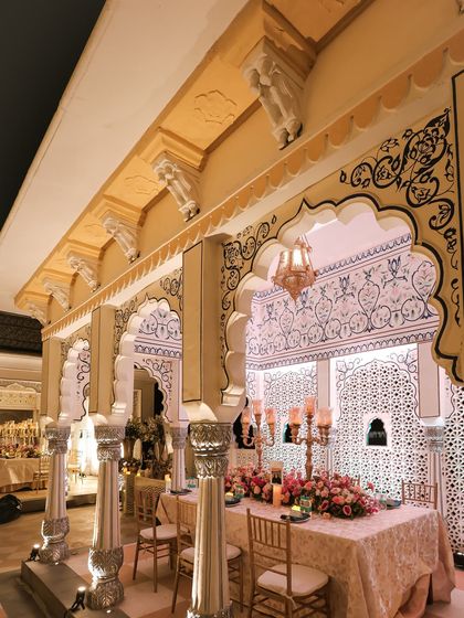 The long banquet tables were set under the beautiful arches of the venue. The architecture itself became a key part of the decor, enhanced by the soft lighting and elegant tablescapes.