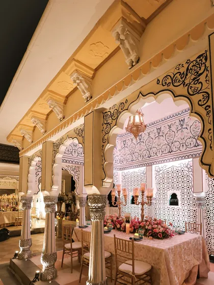 The long banquet tables were set under the beautiful arches of the venue. The architecture itself became a key part of the decor, enhanced by the soft lighting and elegant tablescapes.