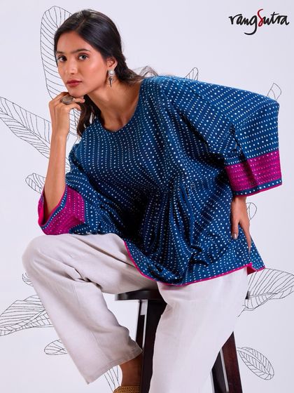 Monsoon is calling, and we're answering with soft, relaxed cotton tops. This piece from our Chaaya collection is naturally dyed, minimally embroidered, and crafted in soothing shades of indigo.