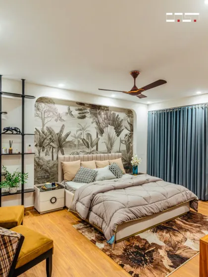 I believe a bedroom should be a personal sanctuary. Here, a custom botanical mural acts as a stunning feature wall, bringing nature indoors and creating a serene, calming environment. The design balances this artistic touch with plush textures and warm wood flooring for ultimate comfort.