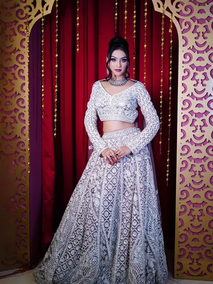 Another beautiful full-length portrait against a rich, red background.