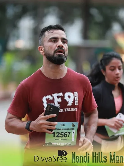 This is me during the Nandi Hills Monsoon Run. It's about finding that focus and pushing through, even on a challenging incline. My coaching helps you develop the mental toughness needed for race day.
