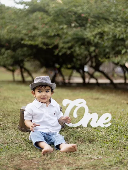 A relaxed and happy portrait from his outdoor first birthday session.