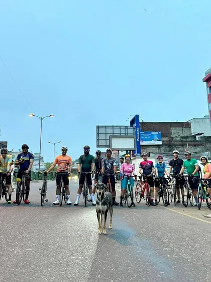 Even our furry friends sometimes join the pre-ride lineup! A stray dog stands front and center with the group before our Sunday spin.