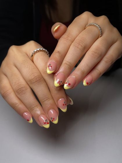 This set just says "freshly picked." The bright yellow French tips are accented with tiny, hand-painted cherries for a fun and summery vibe.