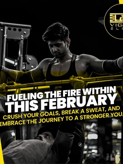 Fueling the fire within. A client performs a bench press with a spotter, a classic strength-building exercise. Our trainers are always there to ensure your safety while you push your limits.