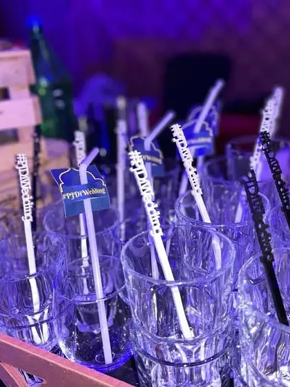 Even the straws get a custom touch. Here, I've added personalized stirrers with the couple's wedding hashtag, ensuring your brand is visible in every photo and every sip.