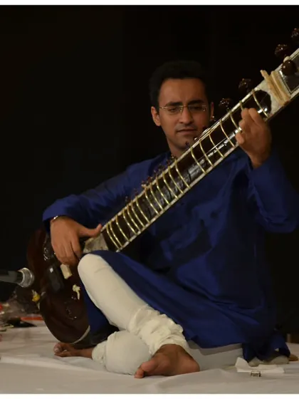 A close-up of my expression during a deeply melodic passage at the India Habitat Centre.