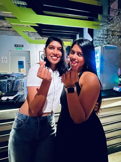 Making friends at the bar. Our friendly atmosphere makes it easy to connect with new people and expand your circle.