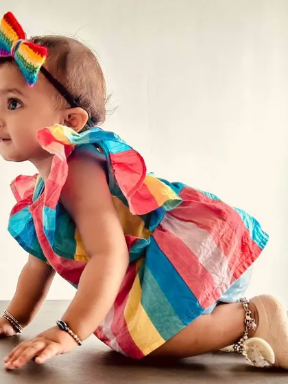Moments like this are what I cherish most. Here is an adorable little customer looking so sweet in our handmade crochet rainbow bow. We design our newborn headbands to be extra soft and gentle on delicate skin.