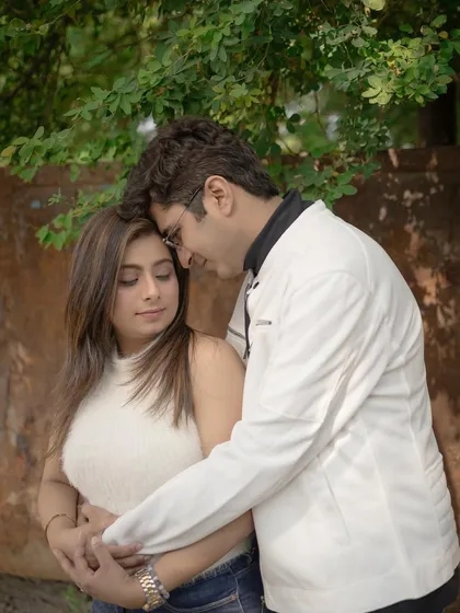 An intimate moment between the couple. The natural makeup look is perfect for close up shots like this, appearing fresh and authentic.