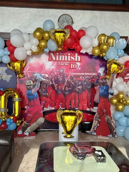 A wide shot of the RCB themed decoration, perfect for a living room or party hall.