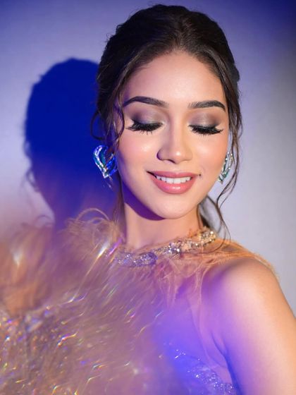 A happy, smiling shot that shows the versatility of the look. Even with dramatic makeup, her natural joy shines through.