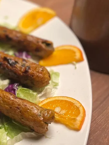 Another view of the seekh kebabs, ready for a catering event. The simple, fresh presentation allows the quality of the food to speak for itself.