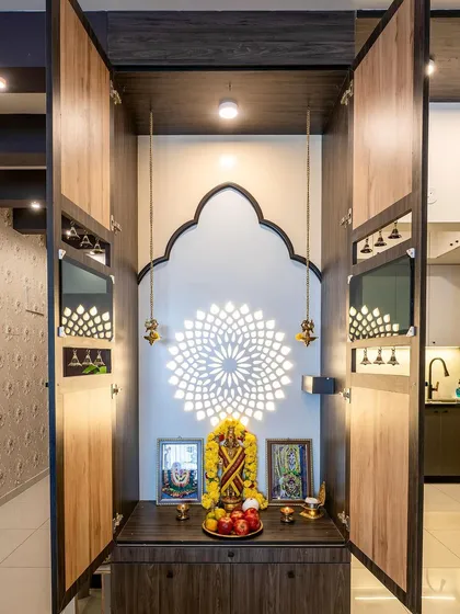 I craft sacred spaces that blend tradition with modern aesthetics. This puja unit features a backlit mandala design within a wooden enclosure, creating a serene and contemporary corner for daily faith and reflection.