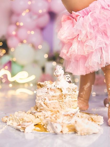 A close-up of tiny feet and a smashed cake. It's the messy details that make cake smash sessions so unique and memorable.