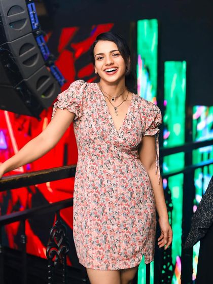 A guest smiling and dancing, captured in a candid moment.