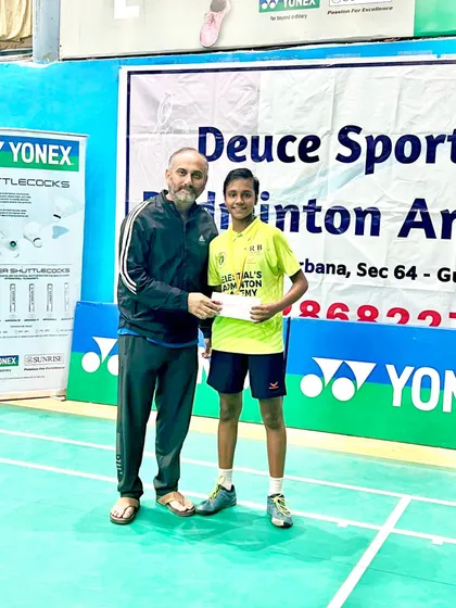 Sneha Kumar receiving her prize after winning the Girls U-13 title at the Deuse Badminton Academy tournament, where she outplayed the current Haryana state champion.