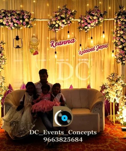 A heartwarming moment from a First Holy Communion celebration we decorated. The stage, with its warm lighting and floral arrangements, provides a beautiful setting for family photos.