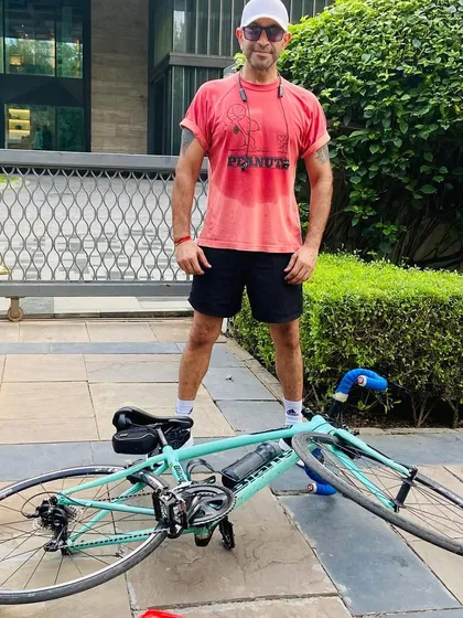 A member taking a break with his bike. Solo shots like these capture the personal journey of each cyclist within the group.