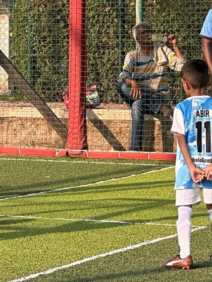 A young player prepares to take a kick. We provide opportunities for even our youngest members to experience real match situations.
