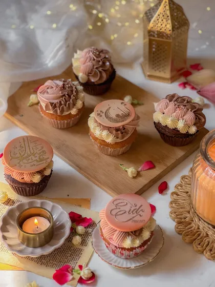 An overhead view of the Eid cupcakes, showcasing the intricate designs and warm color palette. Each one is a small token of celebration.