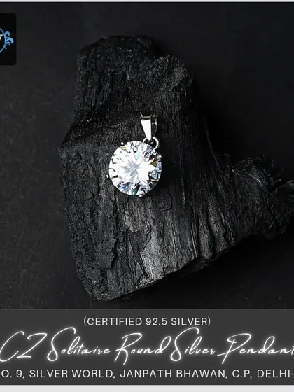 A brilliant-cut CZ solitaire pendant, designed to mimic the fire and sparkle of a real diamond. This is a classic, timeless piece of jewelry that adds instant glamour.