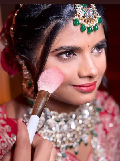A little behind the scenes action. Applying the perfect amount of blush to give this bride a natural, rosy flush for her wedding day. It's all in the details.