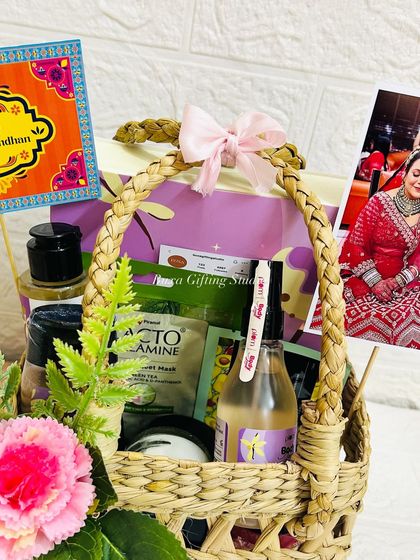 Another angle of the sister's Rakhi hamper, showing the arrangement of the Plum body mist, face masks, and scented candles.
