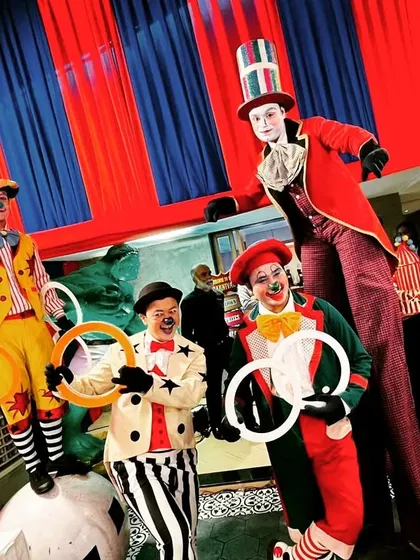 Our carnival entertainers posing for a photo. The vibrant costumes and props were an integral part of creating an immersive and exciting atmosphere for all the guests.