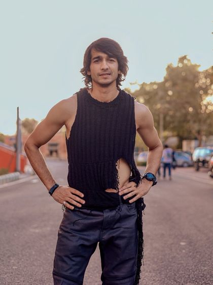 A full-body portrait showcasing the actor's physique and edgy styling, perfect for casting calls requiring a specific look.