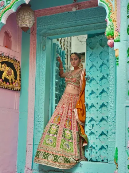 Framed by the beautiful architecture of an old city, this colorful lehenga is a true masterpiece.