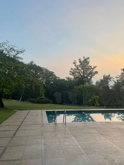 The tranquil pool and garden area as dusk settles in.