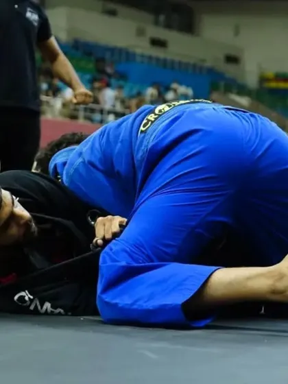 Pressure passing in a Gi match. Using weight and grips to break down the opponent's defenses is a key part of our Gi curriculum.