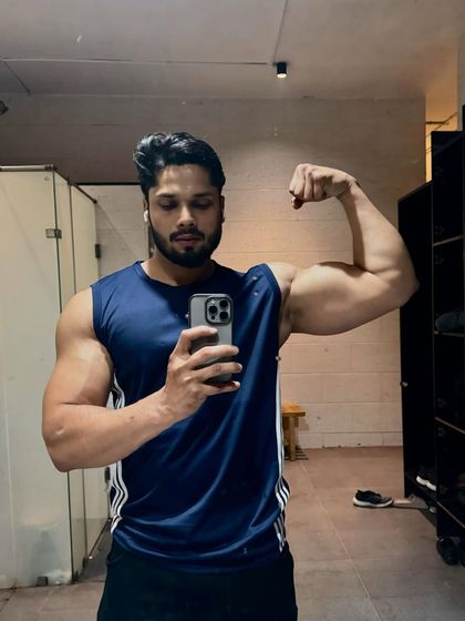 A similar bicep flex, showing consistent progress.