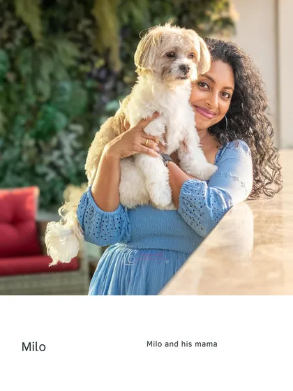 A classic portrait of Milo and his mama, showcasing their close relationship in the warm, natural light of their home.