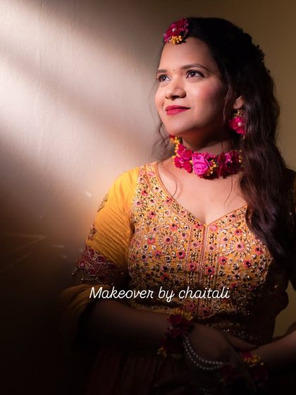 A close-up of the Haldi makeup, showing the soft pink and gold tones on the eyes and a fresh, dewy finish on the skin.